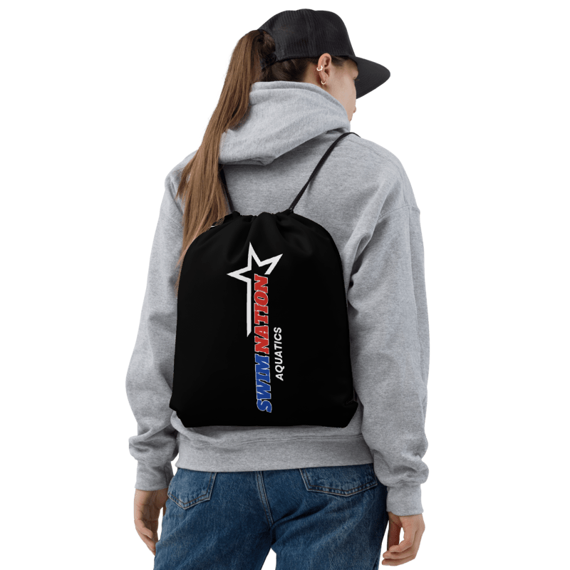 Person wearing a black drawstring bag with 'Swim Nation Aquatics' logo on a white background