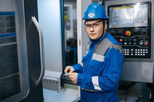 Engineer operating industrial test machinery