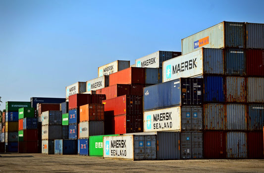 Stacked shipping containers at a cargo port