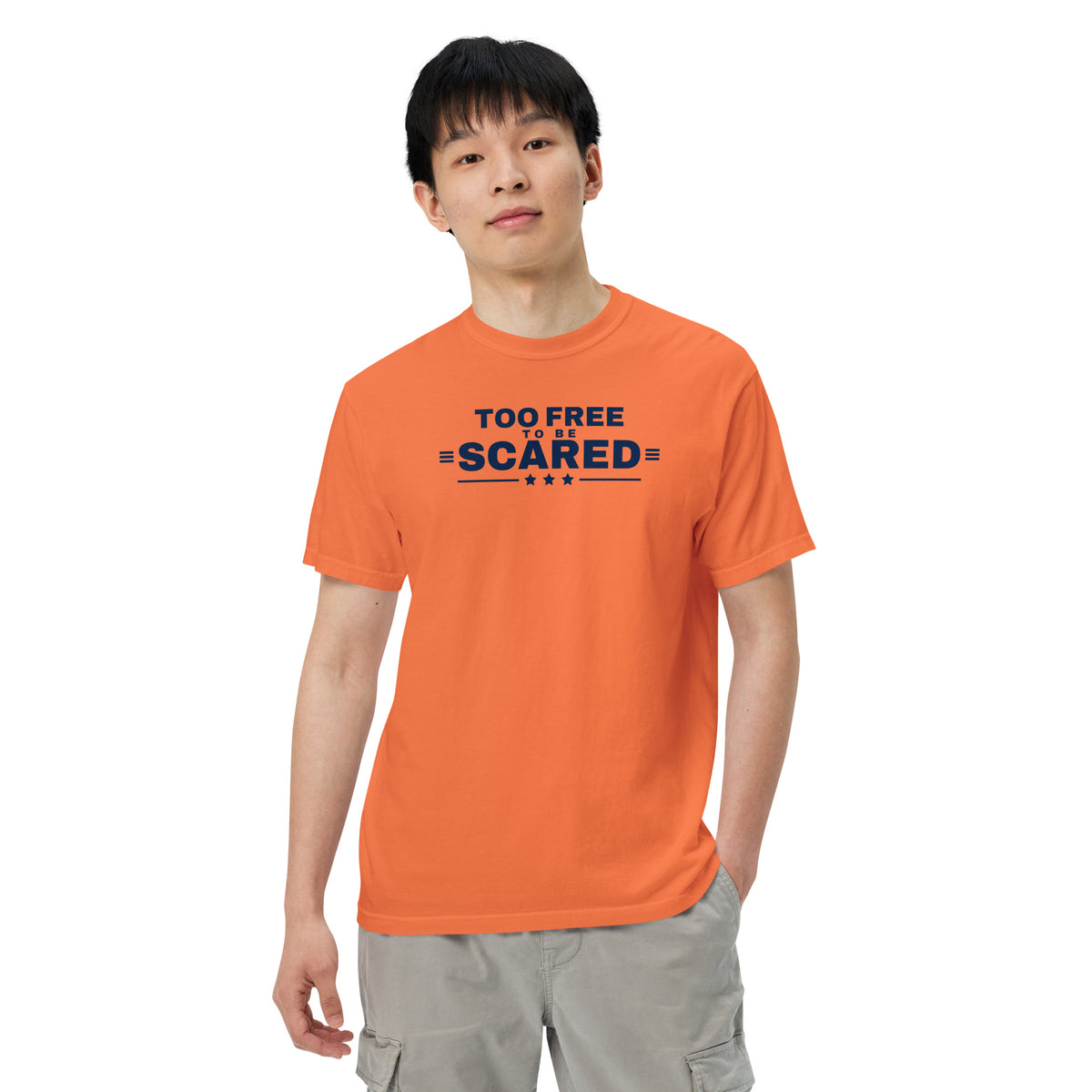Too Free to Be Scared Heavyweight Tee Burnt Orange on model front, relaxed pose | True American